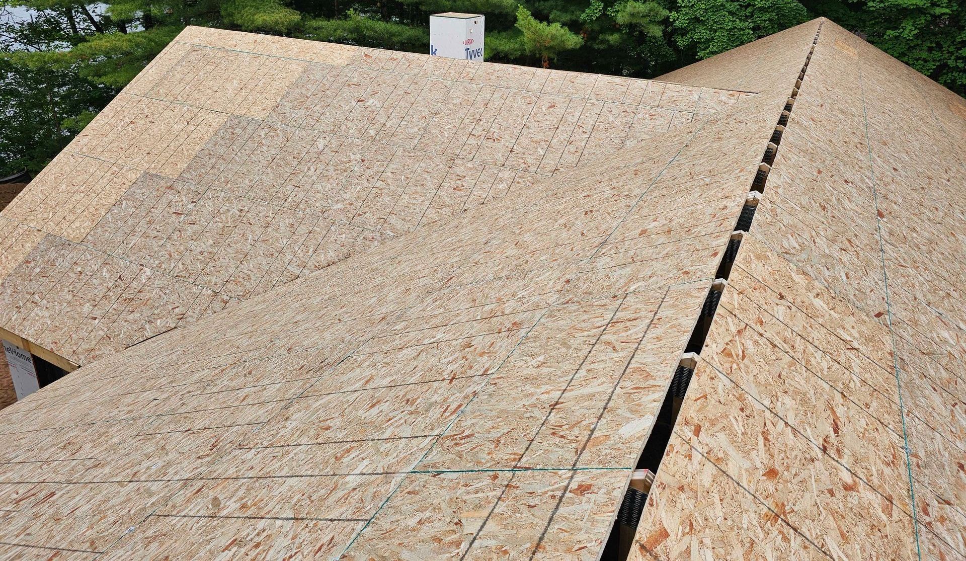 Skilled worker hands carefully arranging and securing roof tiles, creating a durable and precise roofing structure.
