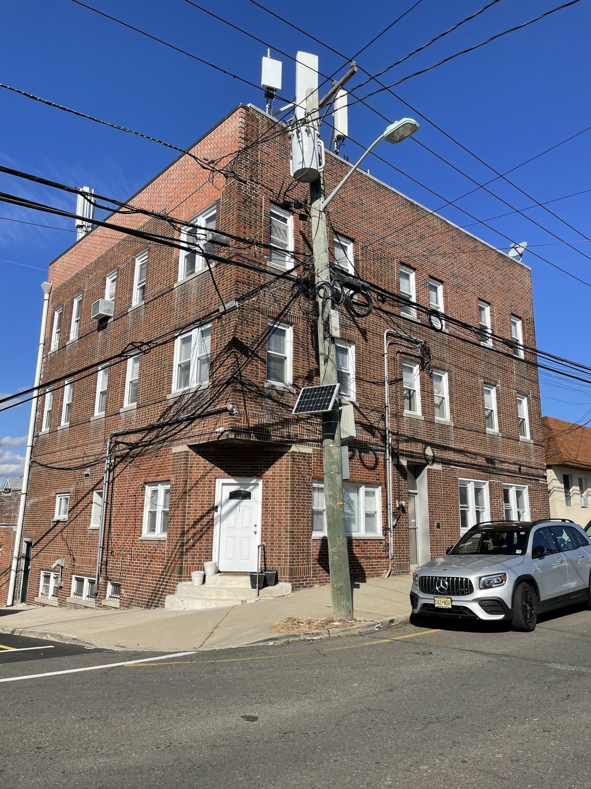 Exterior of 331 Harrison Ave, Garfield, NJ - 7 Unit . Brick three-story building.
