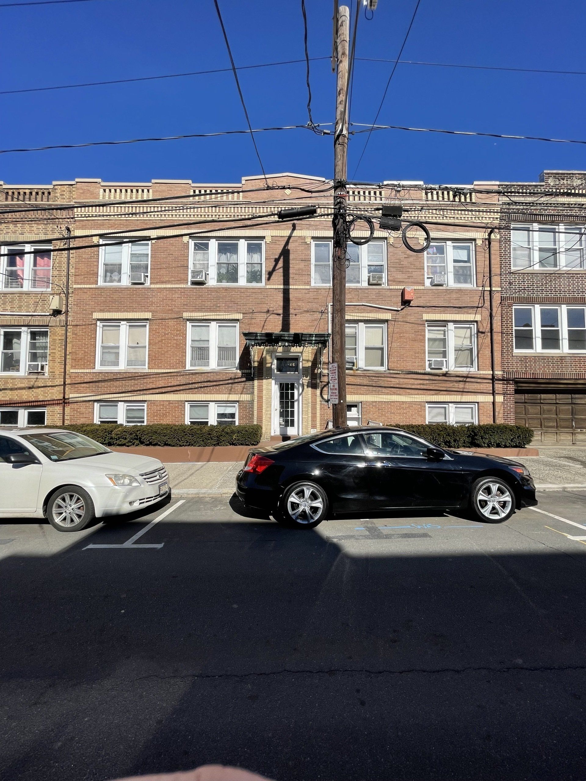 Exterior of 44-46 63rd St. West New York, NJ - 12 Unit. Brick three-story building.