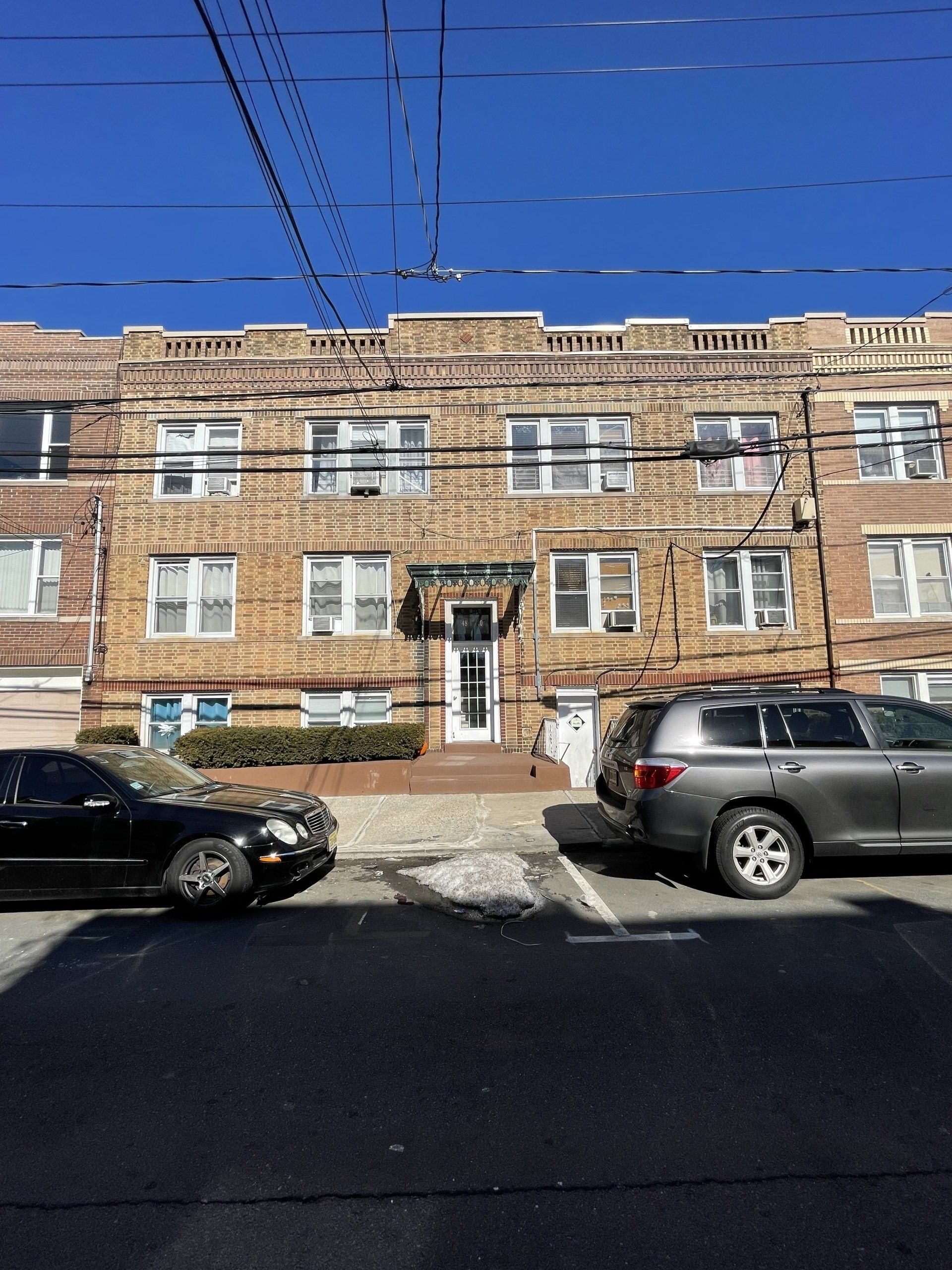 Exterior of 48-50 63rd St. West New York, NJ - 12 Unit. Brick three-story building.