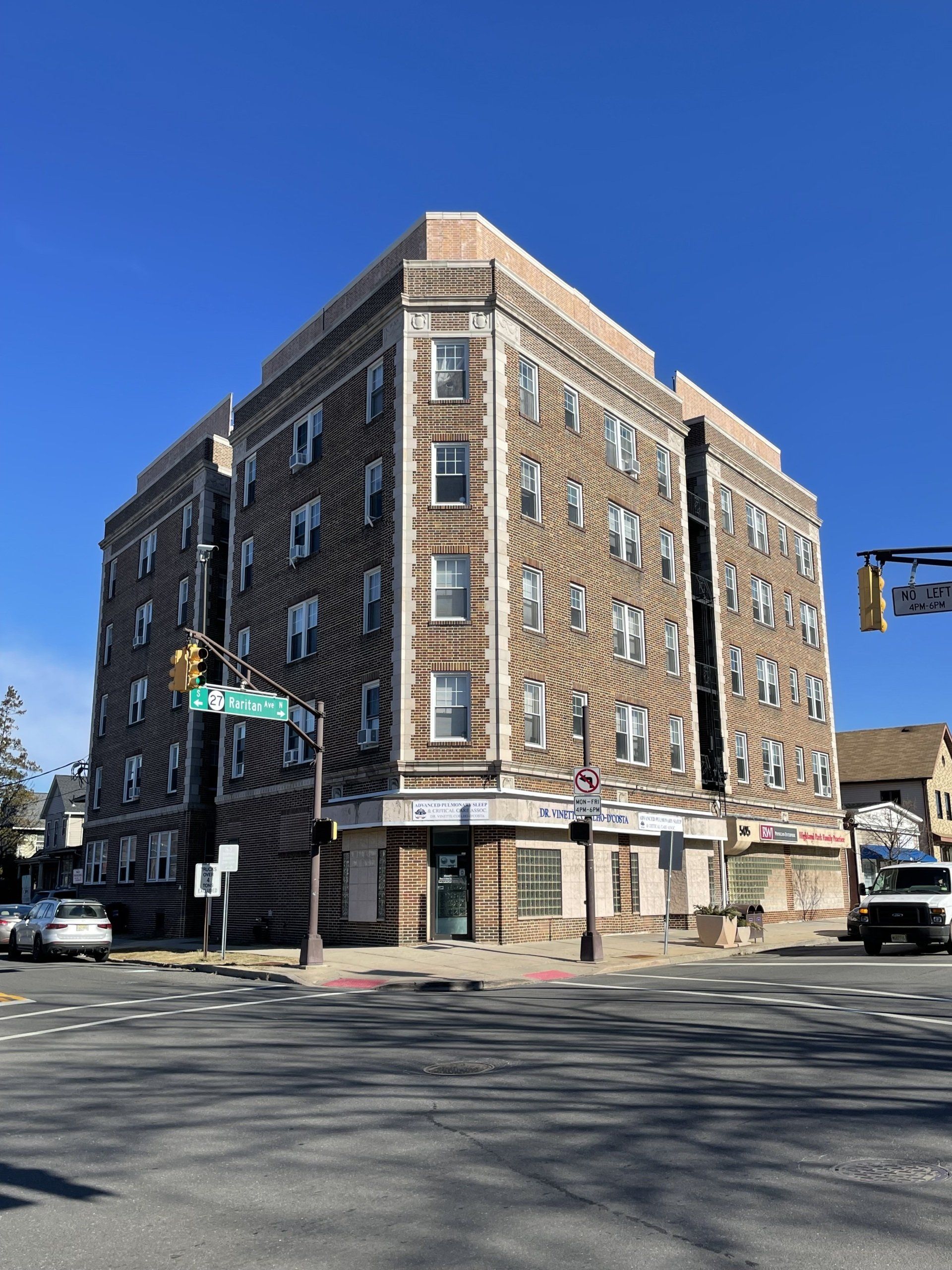 Exterior of 501 Raritan Ave, Highland Park, NJ - 26 Unit. Brick four-story building.