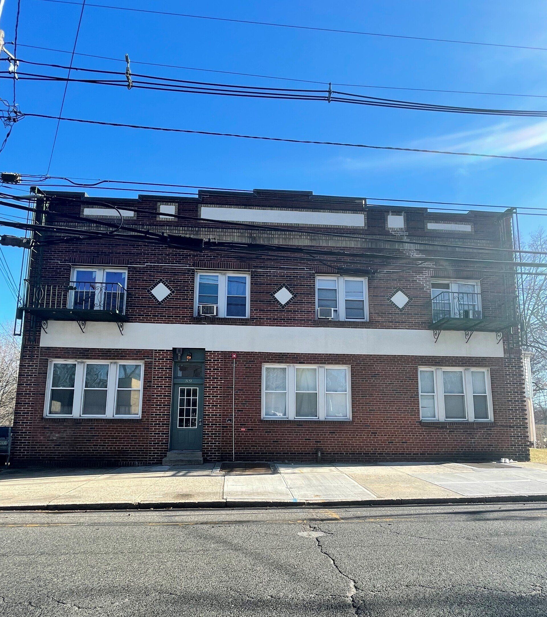 Exterior of 89 Lafayette Place, Englewood, NJ - 7 Unit . Brick two-story building.