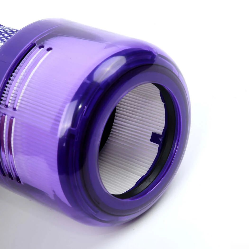 Purple vacuum filter, circular opening, white filter paper inside, close-up.