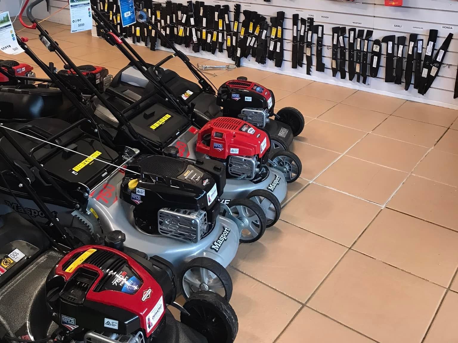 Set Of Mowers In A Shop