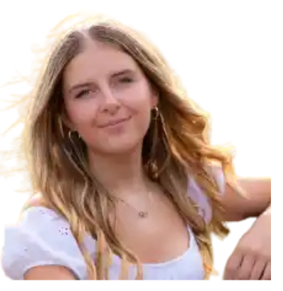Blonde woman smiles outdoors, wearing a white top and hoop earrings, with a soft focus background.