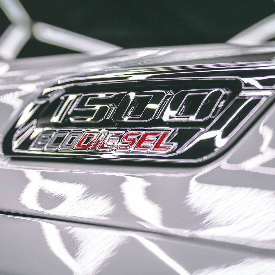 Close-up of a silver truck emblem with 