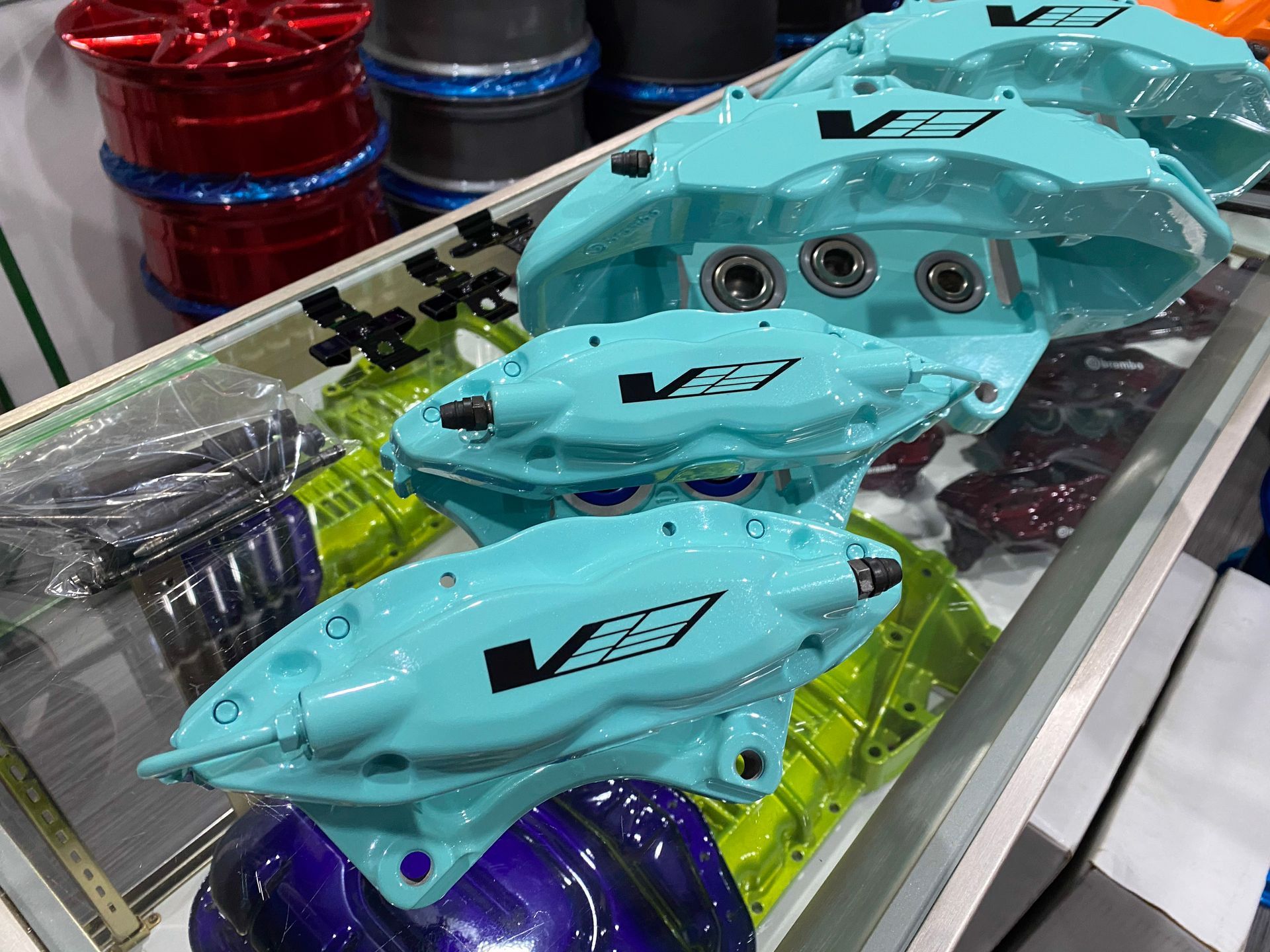 Turquoise car brake calipers with black 
