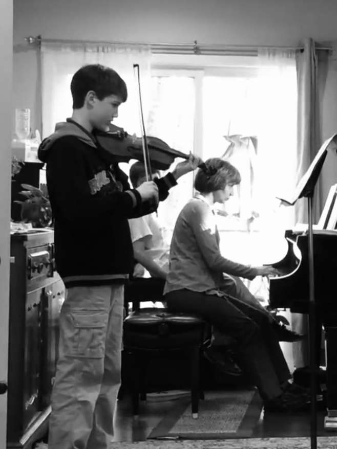 boys playing violin and piano