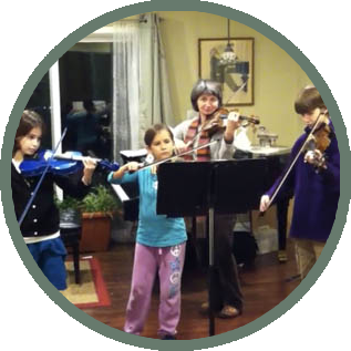 children together with rachel playing violin