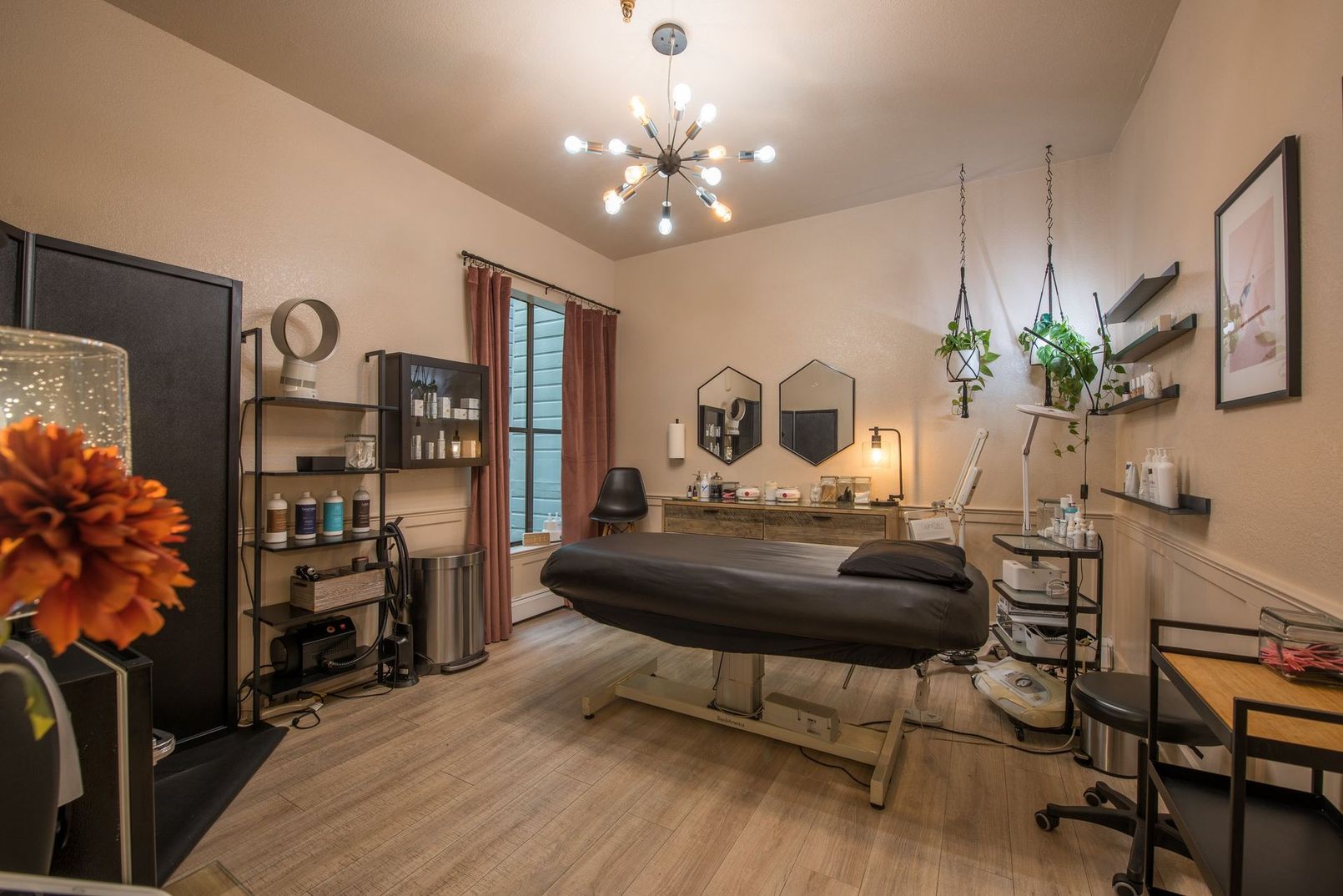 There is a massage table in the middle of the room.