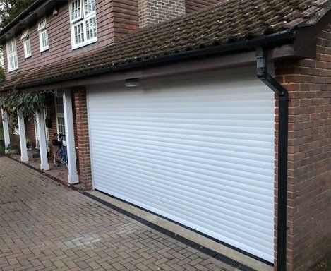 Safety compliant roller garage doors