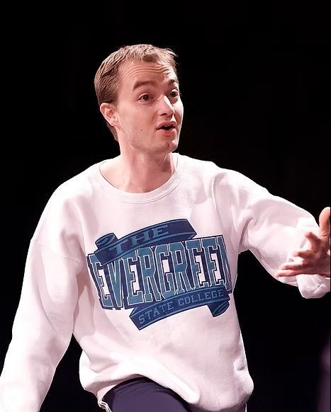 A man wearing a sweatshirt that says the state of texas
