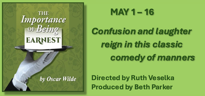 Two men in suits and hats are dancing on a stage