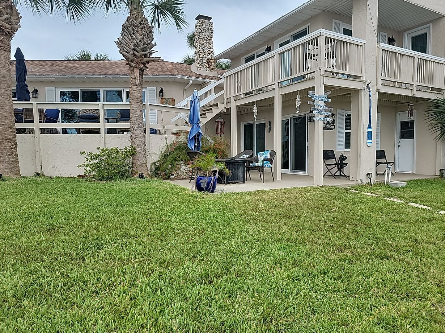 A large house with a large lawn in front of it.