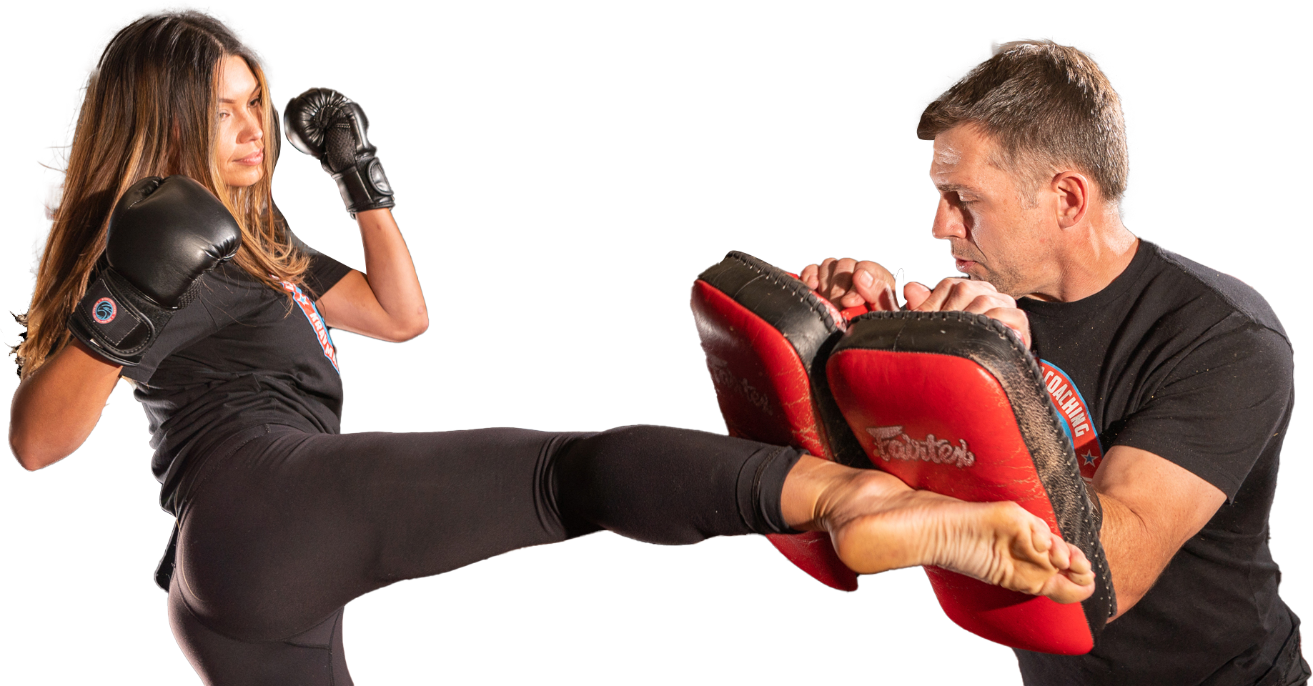a man and a woman are practicing martial arts together .