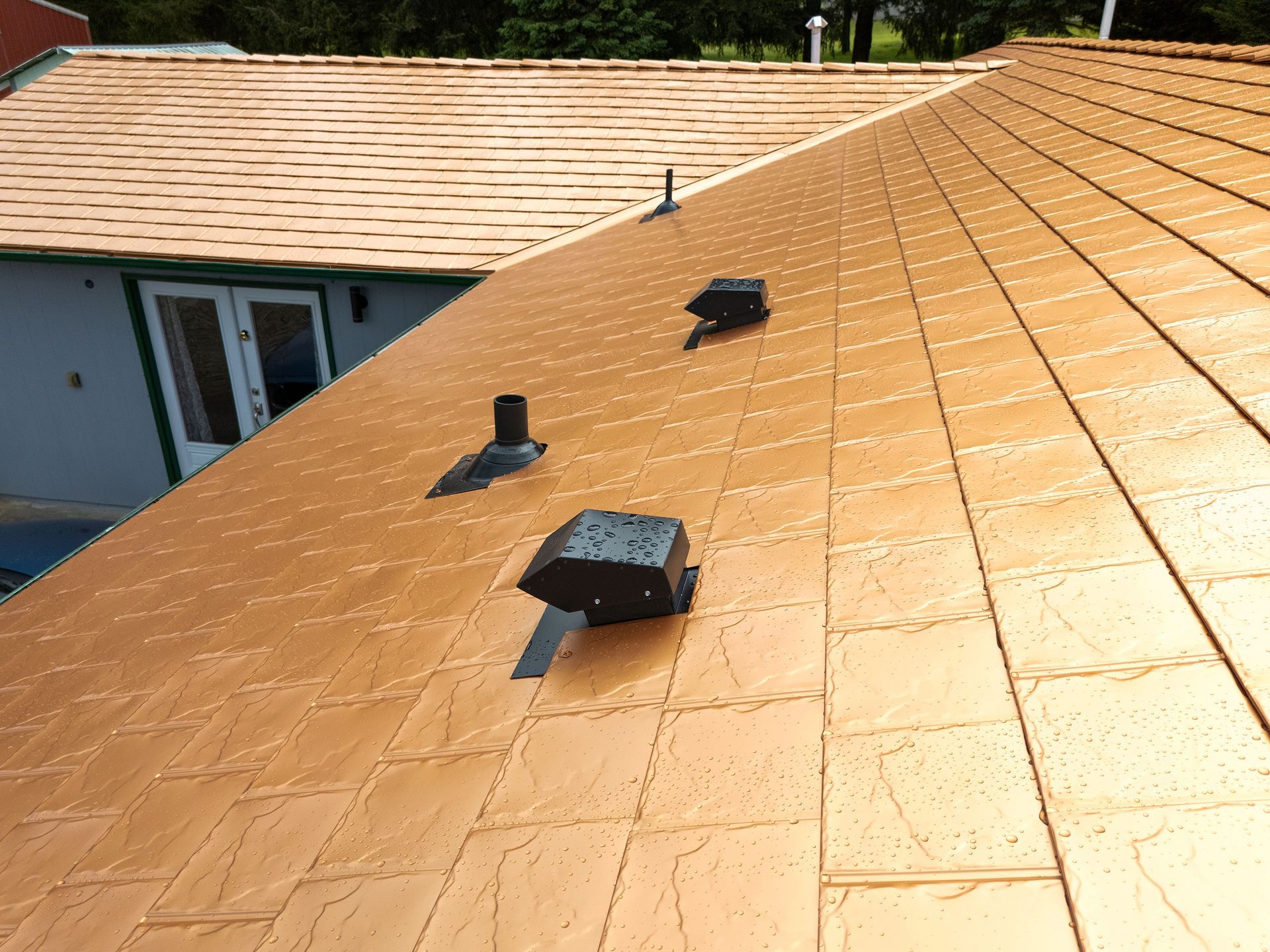 Detail image of roof vent integration on a Copper Penny aluminum slate roof installed by Interlock Metal Roofing in Castle Rock, WA. Image showcases energy-efficient aluminum tiles paired with high-performance ventilation components, ideal for modern roof system functionality in Washington State.