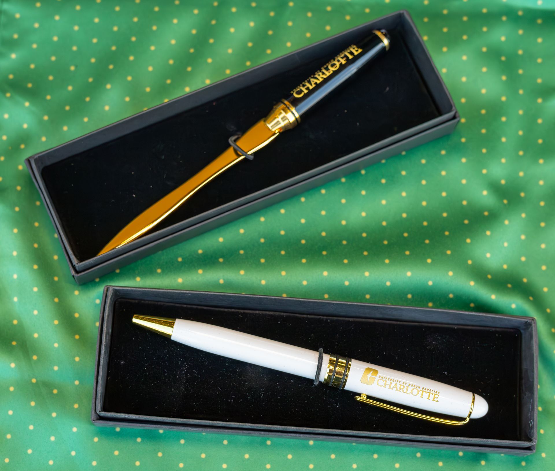 Letter opener and pen set in black boxes, featuring 