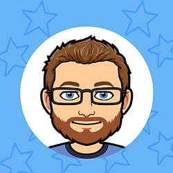 A woman in a white shirt is sitting at a table with a notebook.