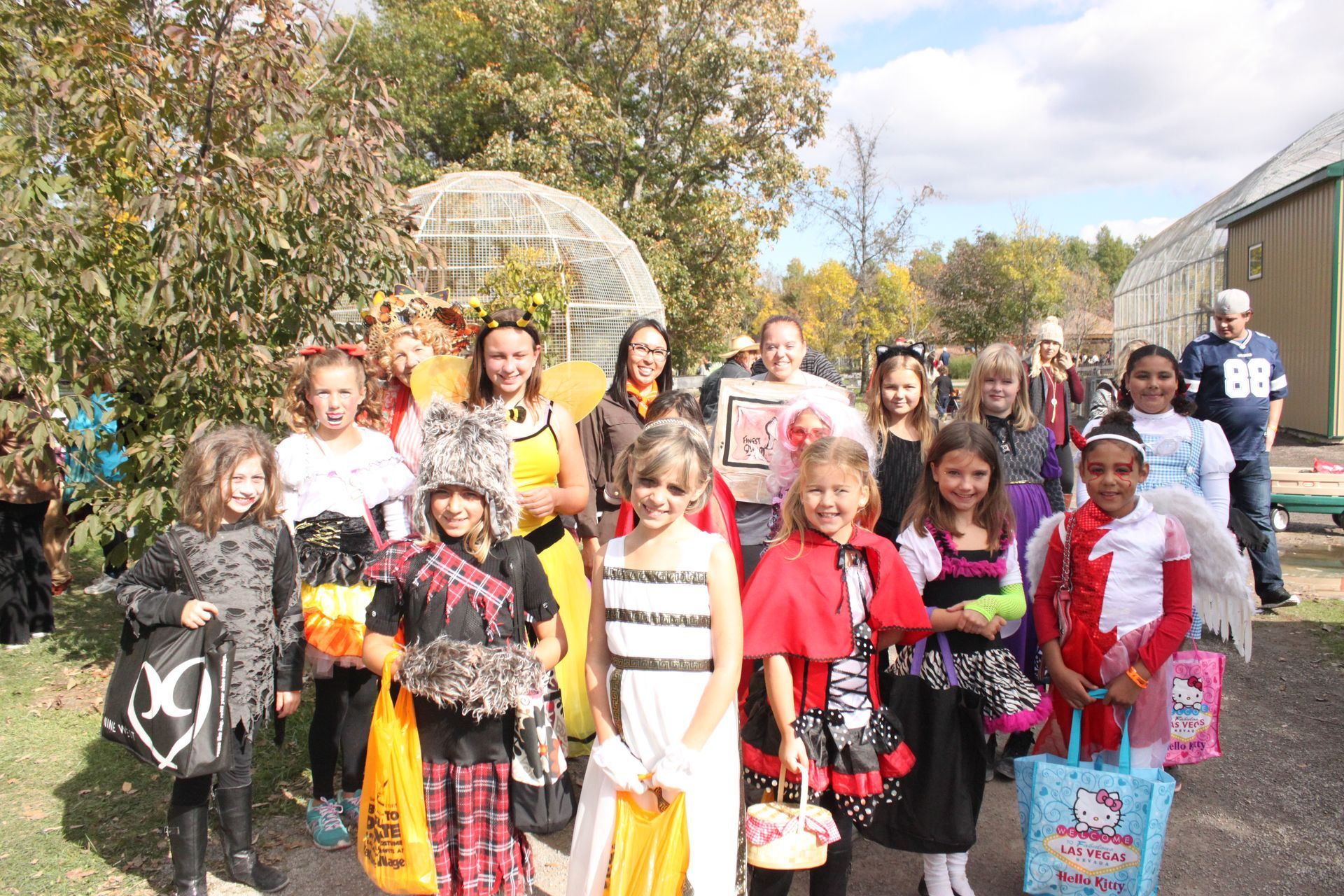 a group of children in halloween costumes pose for a photo at an ontario zoological park