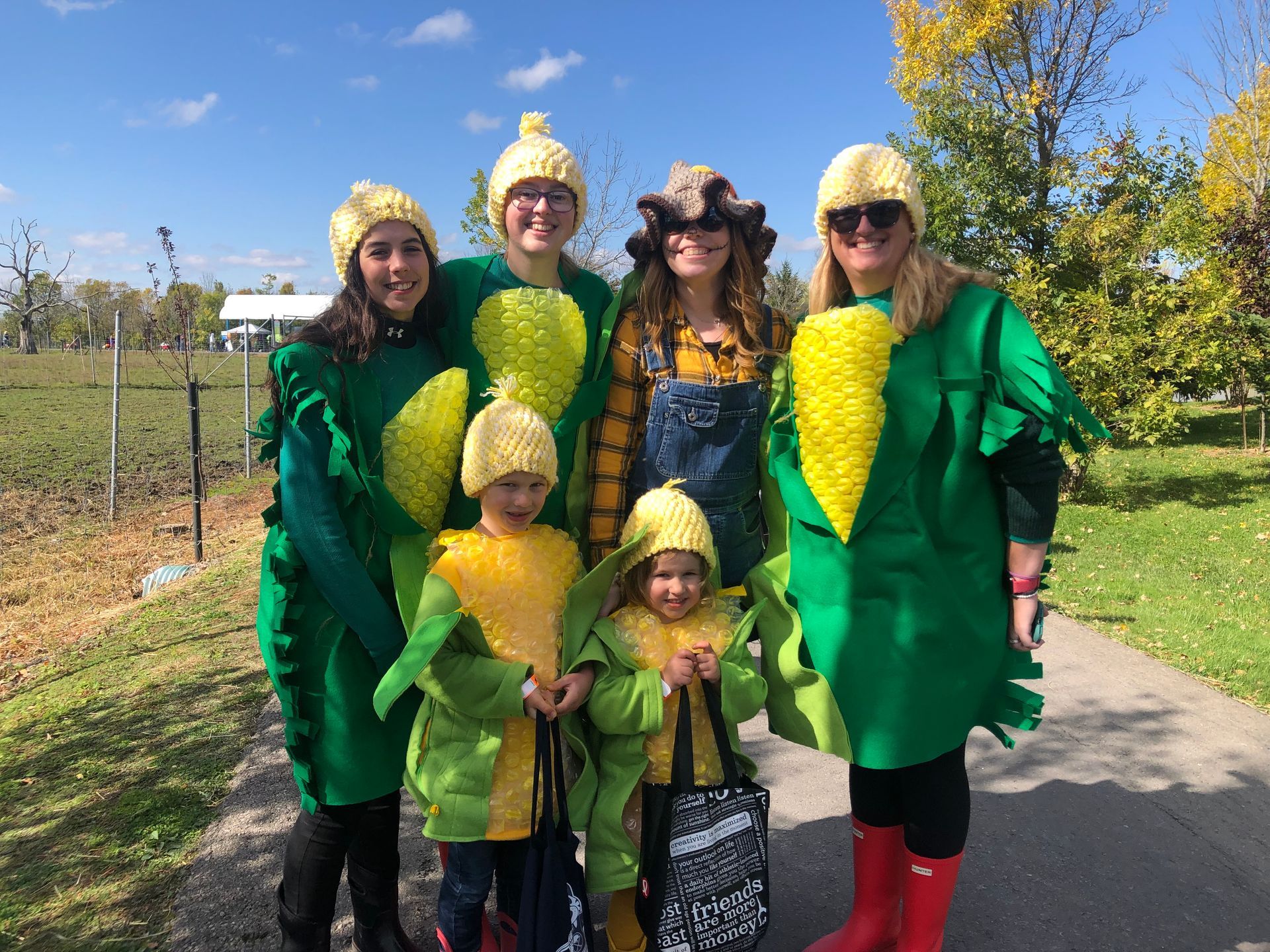 a group of people dressed in corn on the cob costumes