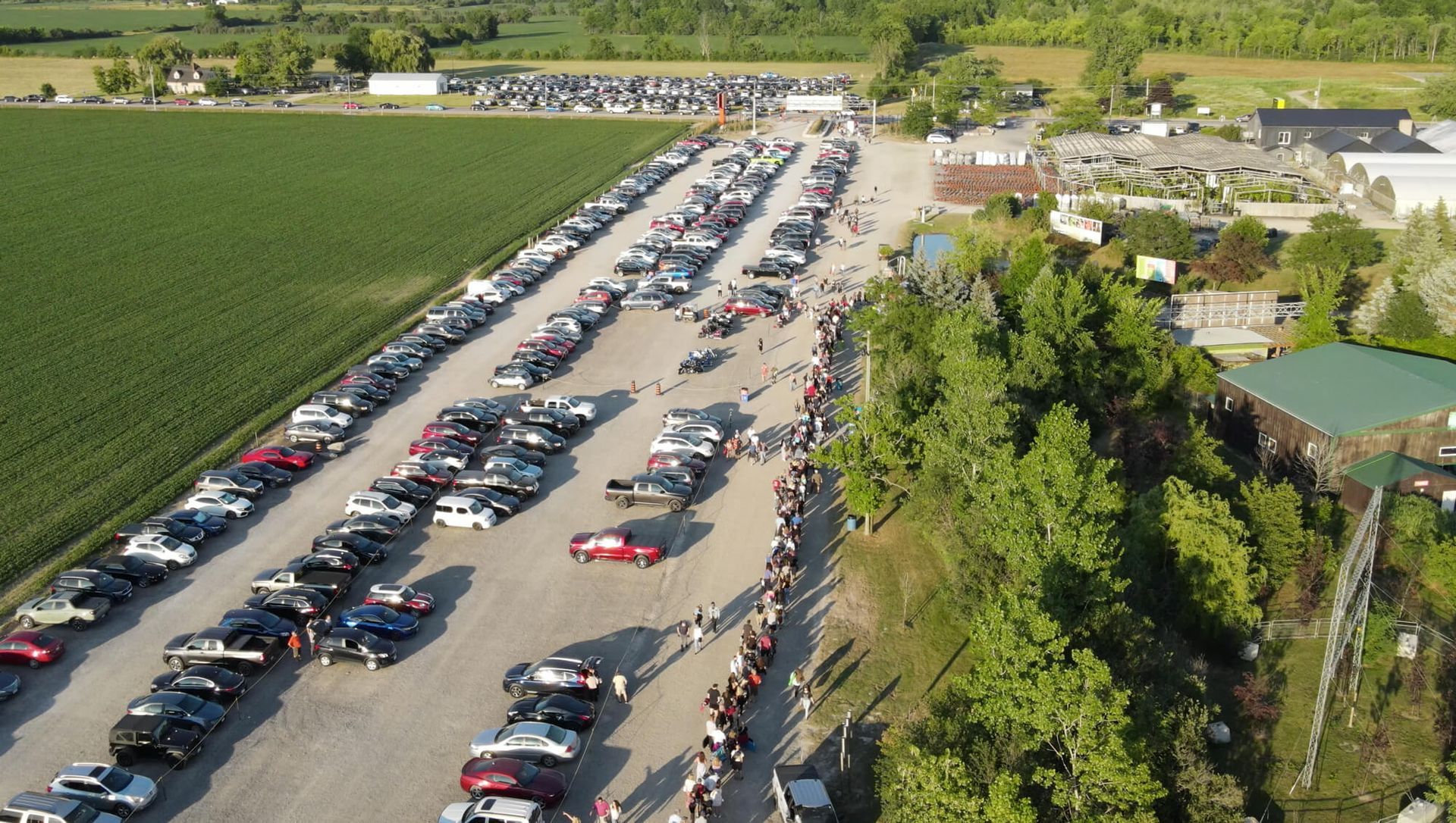 an aerial view of a parking lot full of cars