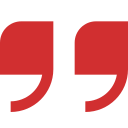 A pair of red quote marks on a white background.
