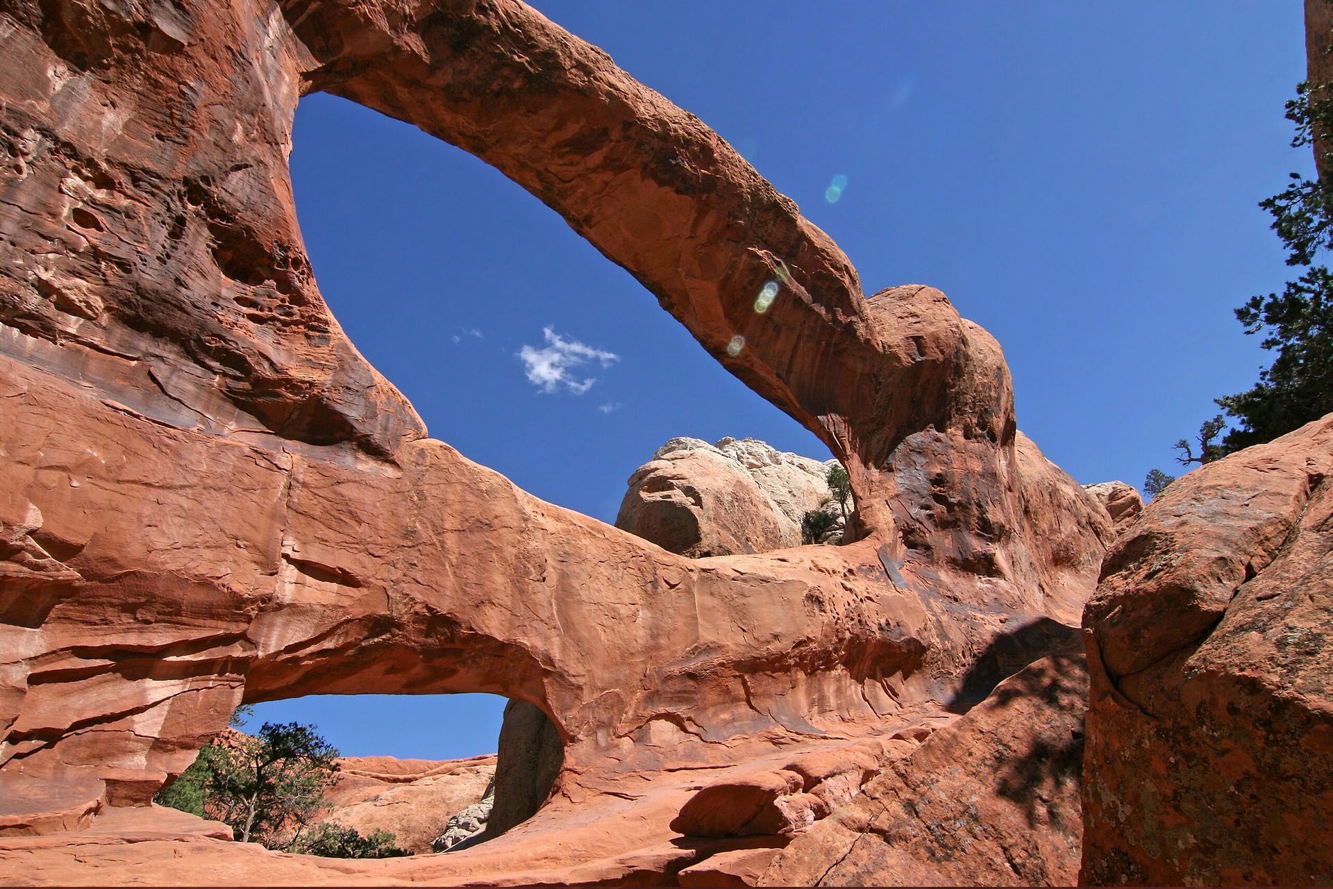 Double O Arch has two massive holes in the cliff face stacked one on top of the other. 