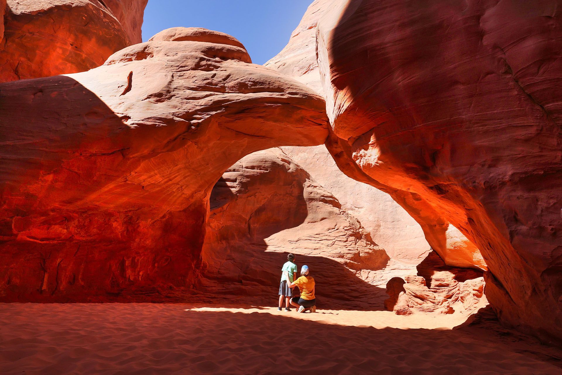 Sand Dune Arch in a shaded narrow slot canyon is a favorite for young kids.