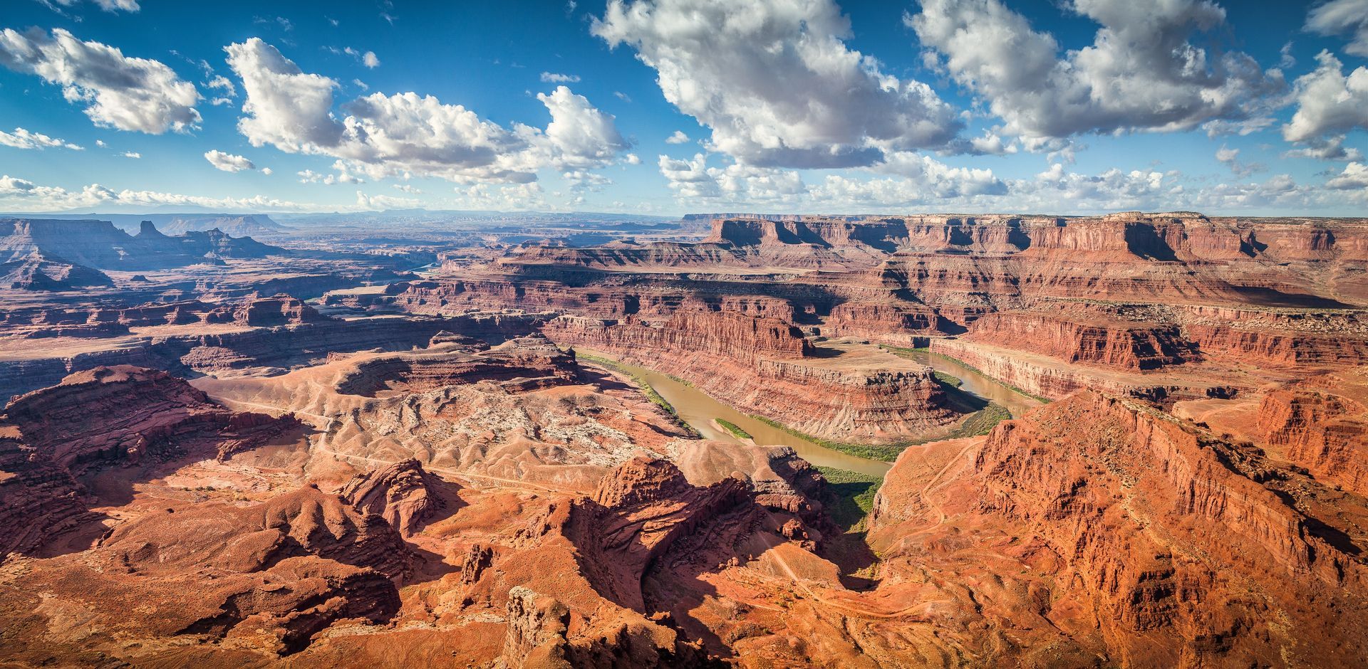 A view of a canyon with a river running through it.