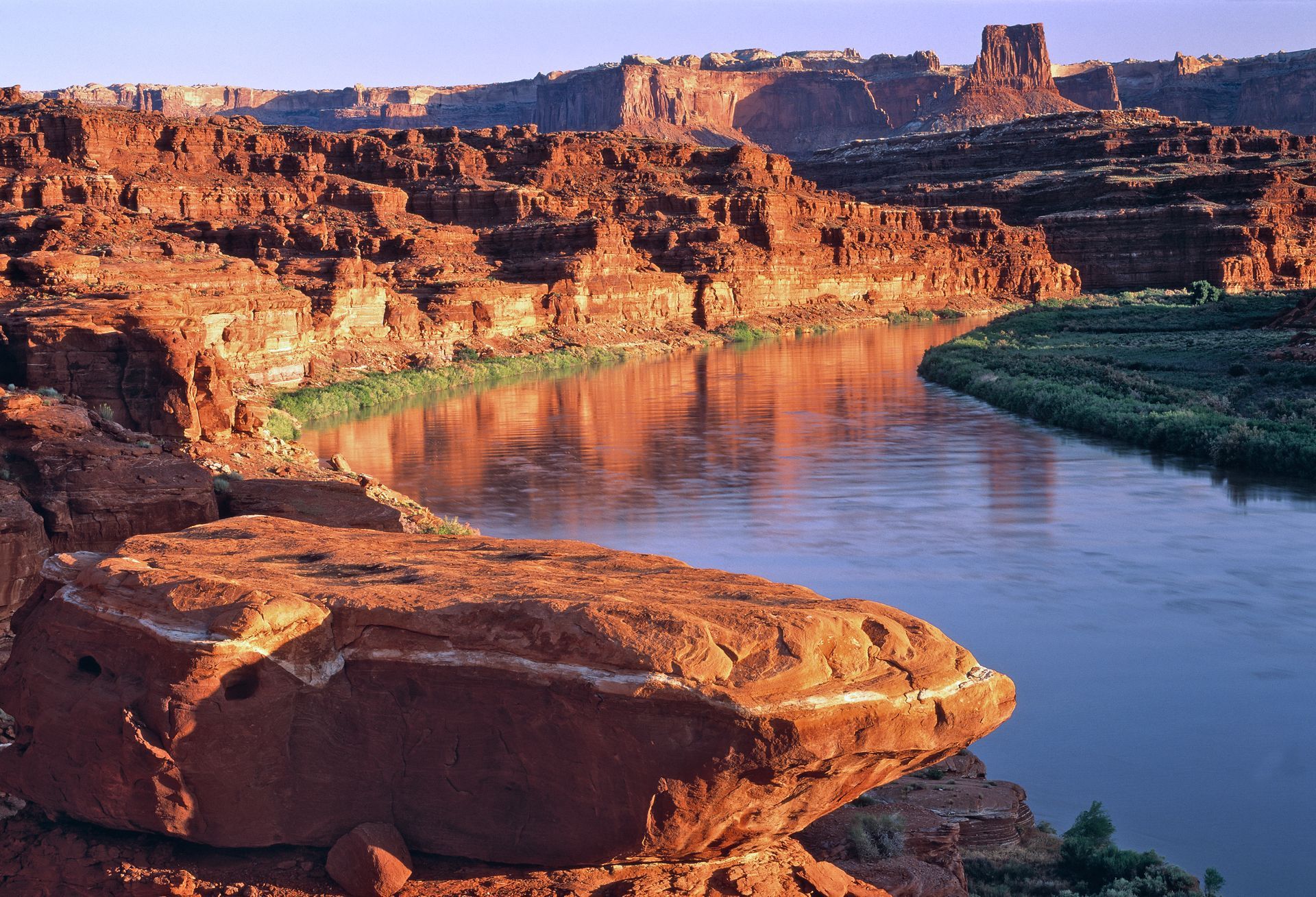 The Colorado River winds through dramatic cliffs of Canyonlands.