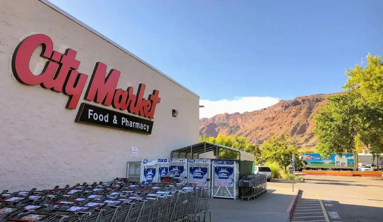 City Market sign with shopping carts.