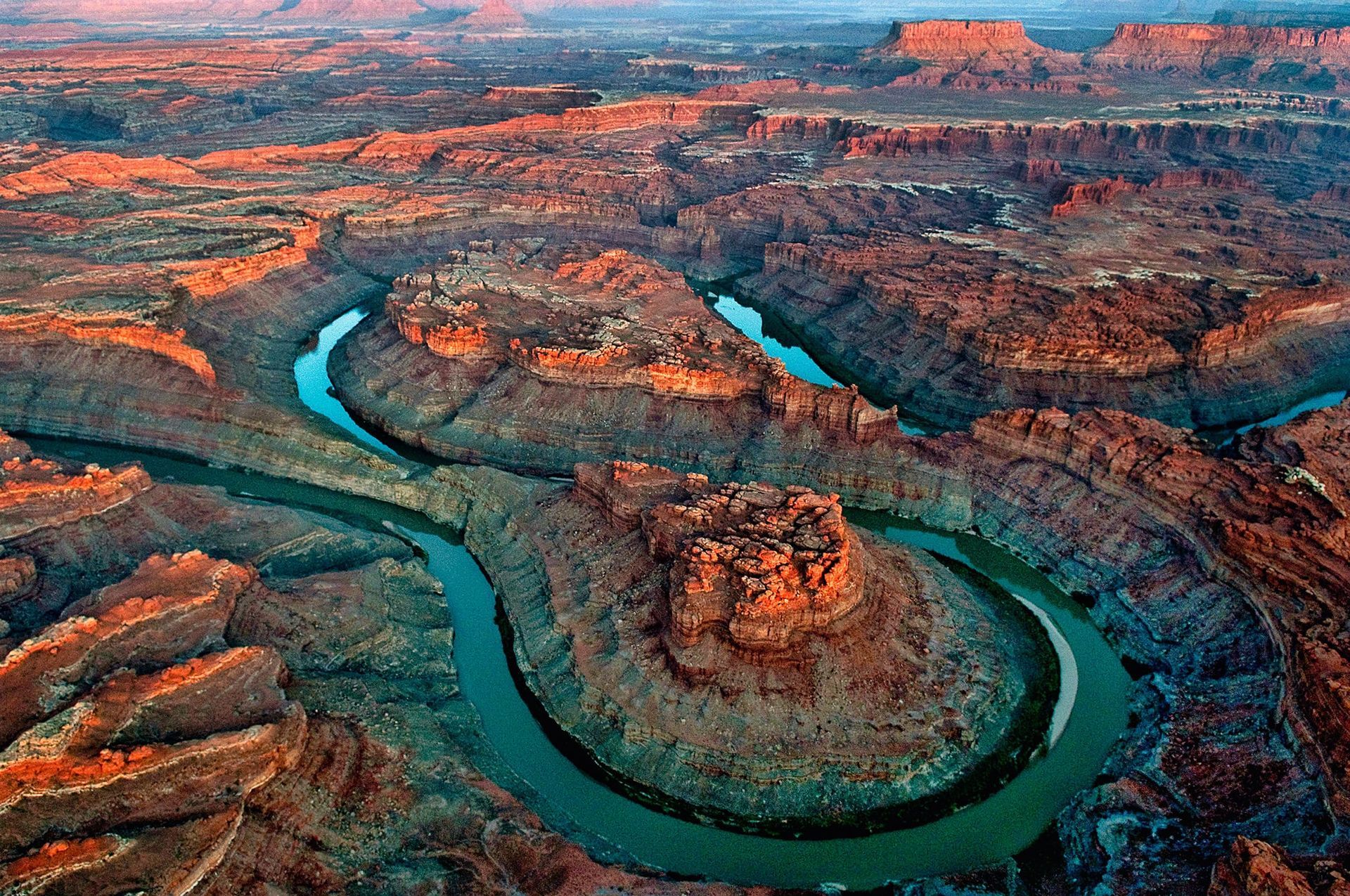 Red rock canyon landscape with the Colorado River cutting through it.