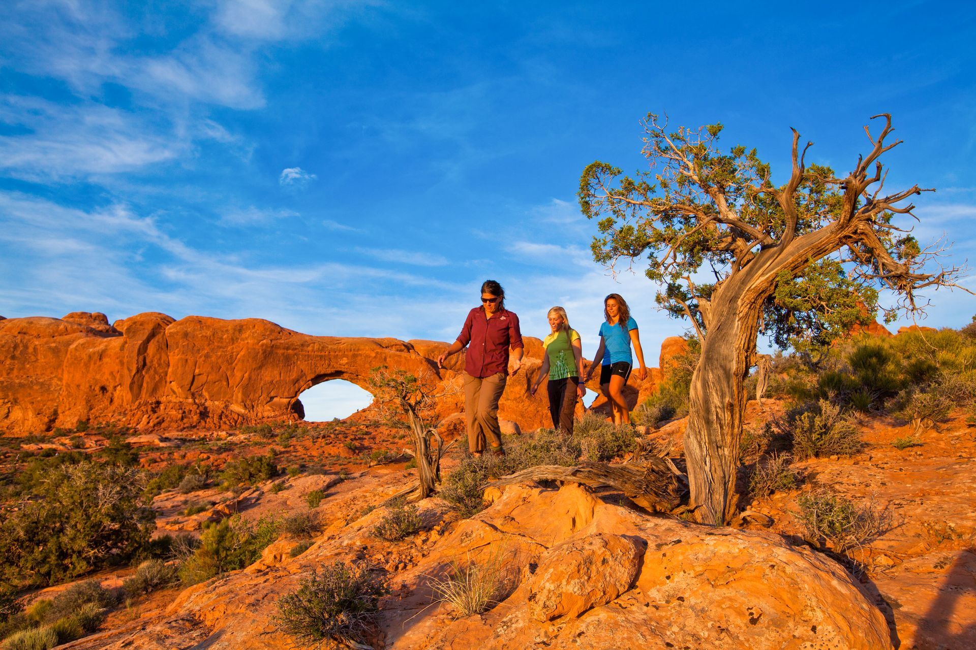 A family hiking in Arches National Park