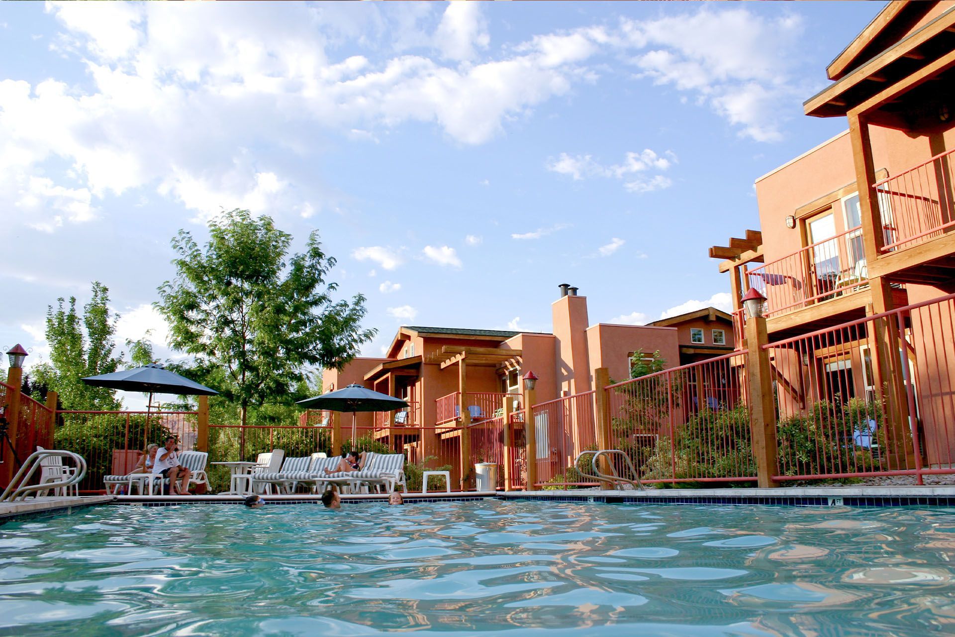 The Gonzo Inn entrance: a red rock sign, Southwest-style building, illuminated at dusk.