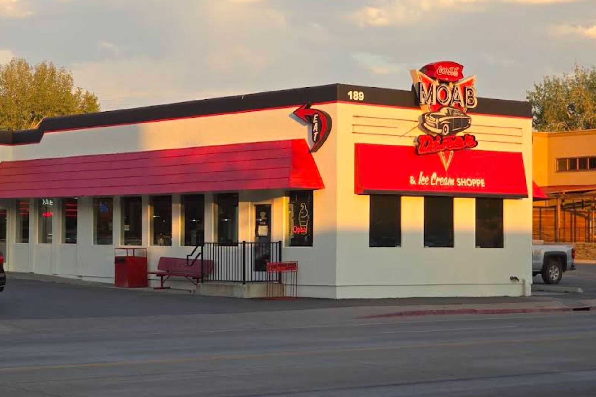 The Moab Diner in downtown Moab, red awning over windows with a 50s style sign.