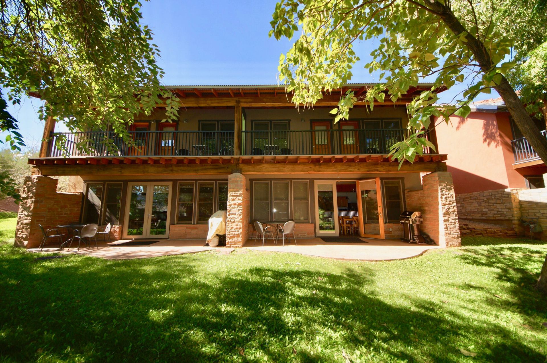 Moab Springs Ranch property at the edge of a grassy area.