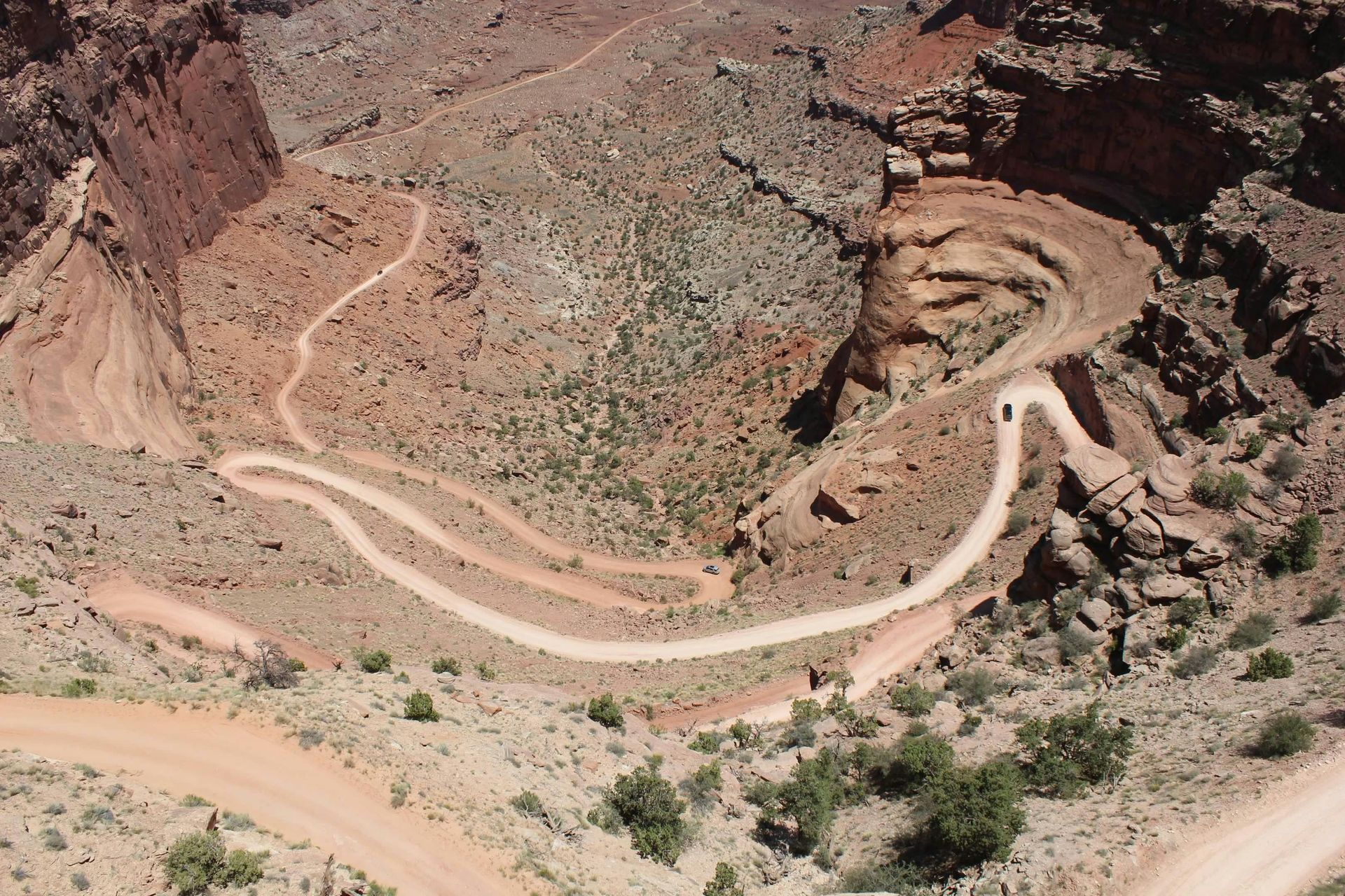 An aerial view of a dirt road in the desert
