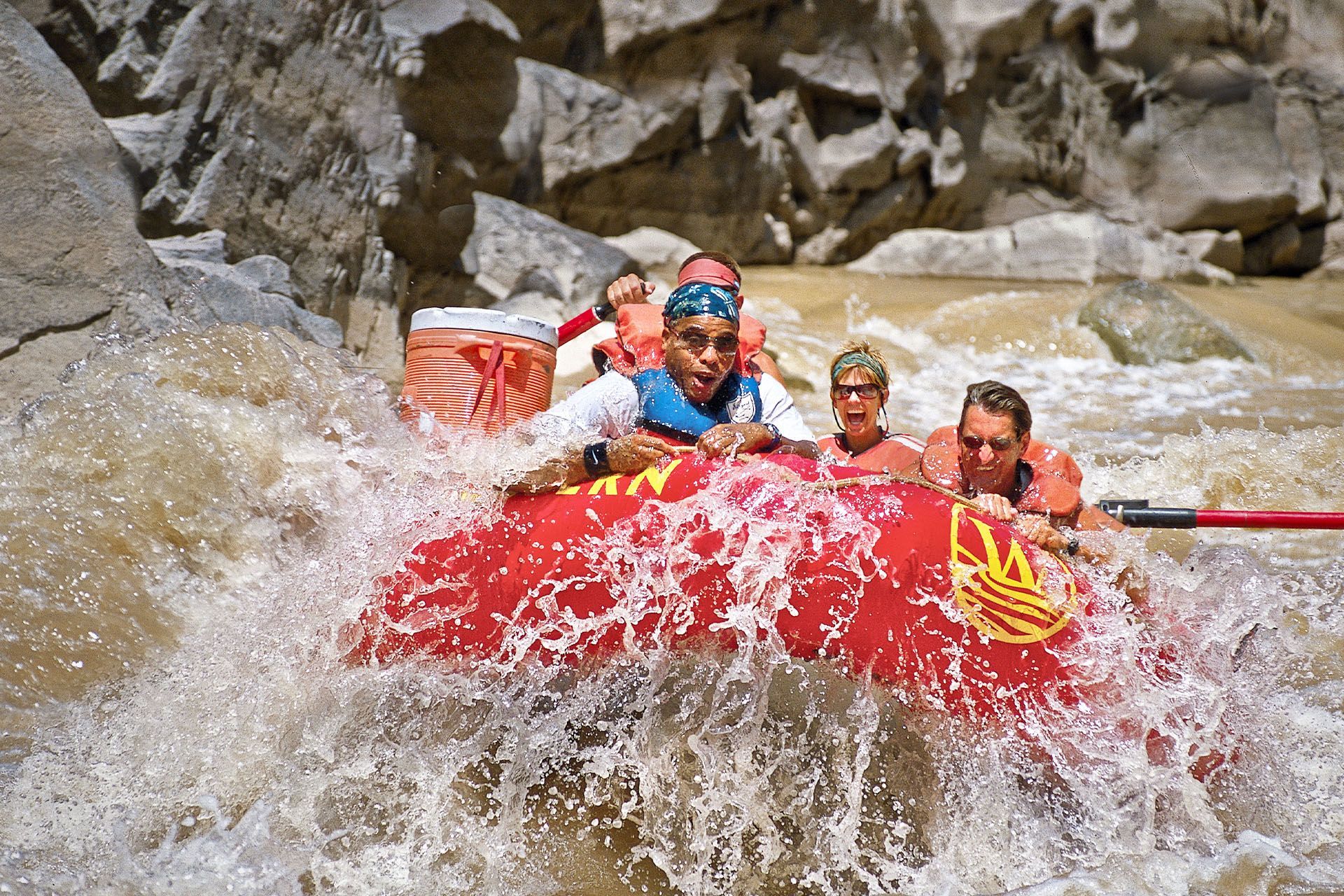 A group of people are rafting down a river.