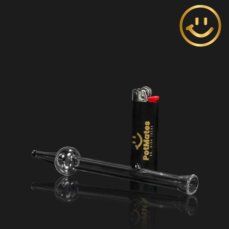 A glass pipe and black lighter on a dark surface, a gold smiley face logo in the top right corner.
