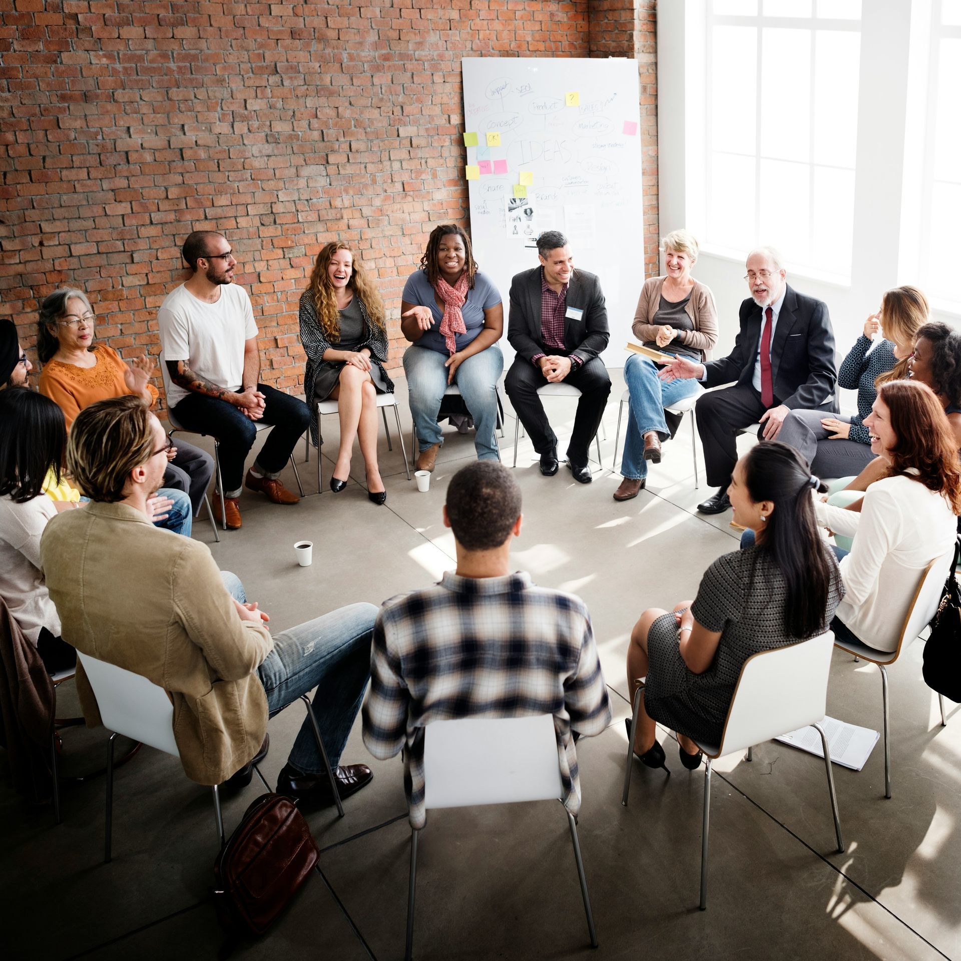 People in a circle doing group support and personal development work