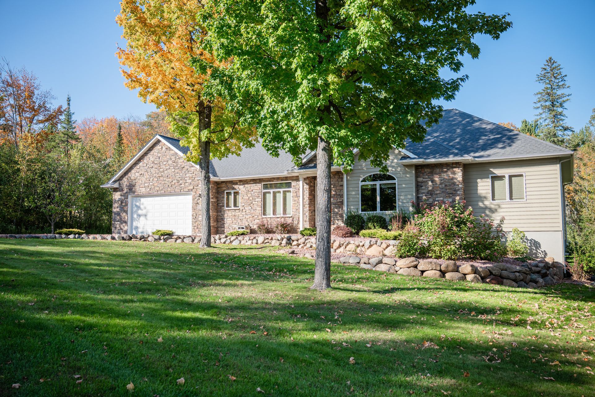 A house with a large deck and stairs leading to it