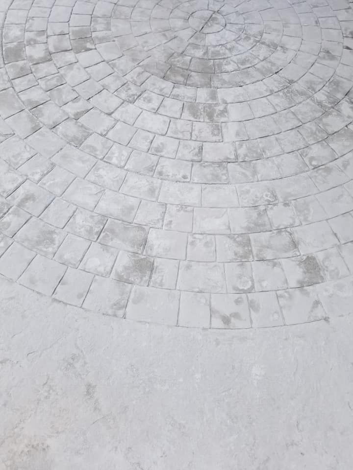 Circular stone pavement pattern.