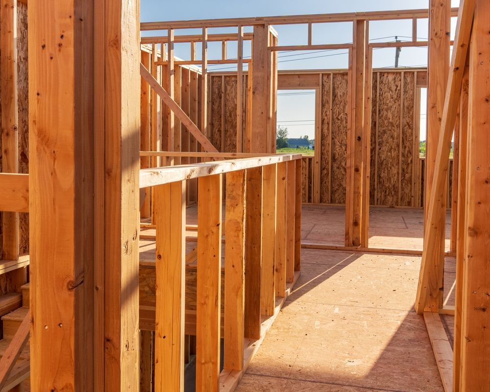 Wooden frame of a house under construction; interior view.