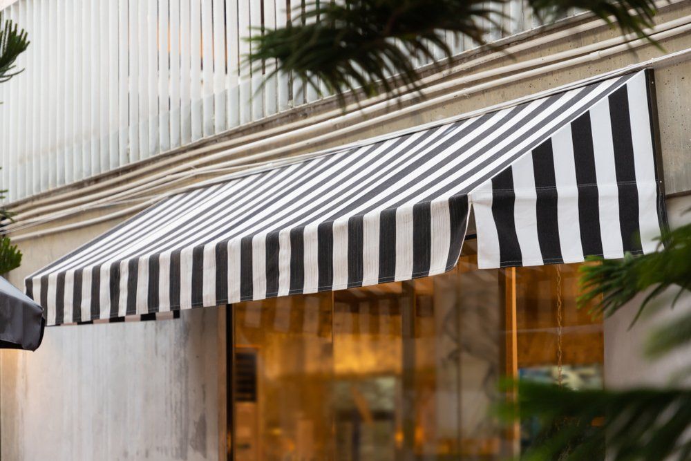 Black & White Awning Over Shop Window — Studio Curtains & Blinds in Mount Gravatt, QLD