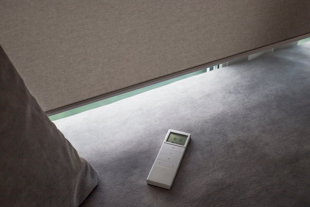 White Remote Control Panel For Motorised Blinds — Studio Curtains & Blinds in Mount Gravatt, QLD