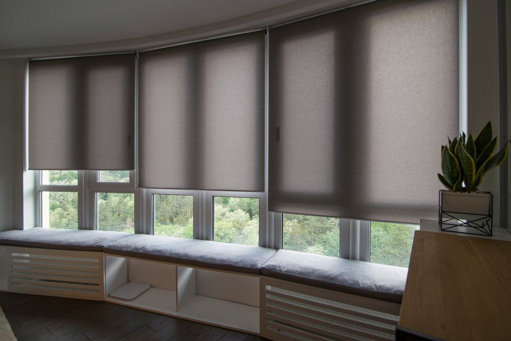 Automatic Roller Blinds On A Big Glass Window — Studio Curtains & Blinds in Mount Gravatt, QLD