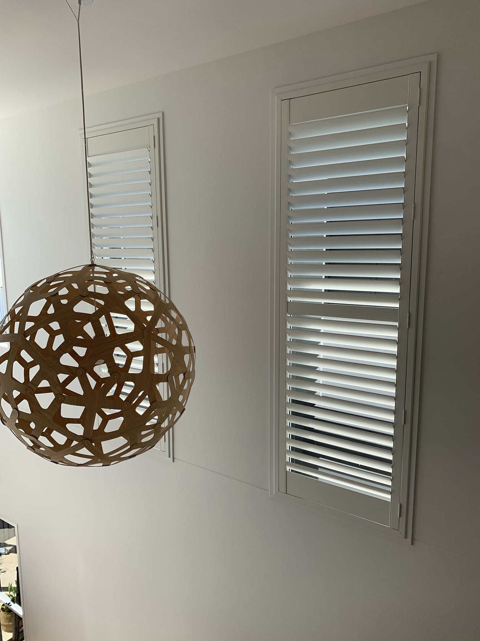 Shutters And A Rattan Pendant Light — Studio Curtains & Blinds in Mount Gravatt, QLD