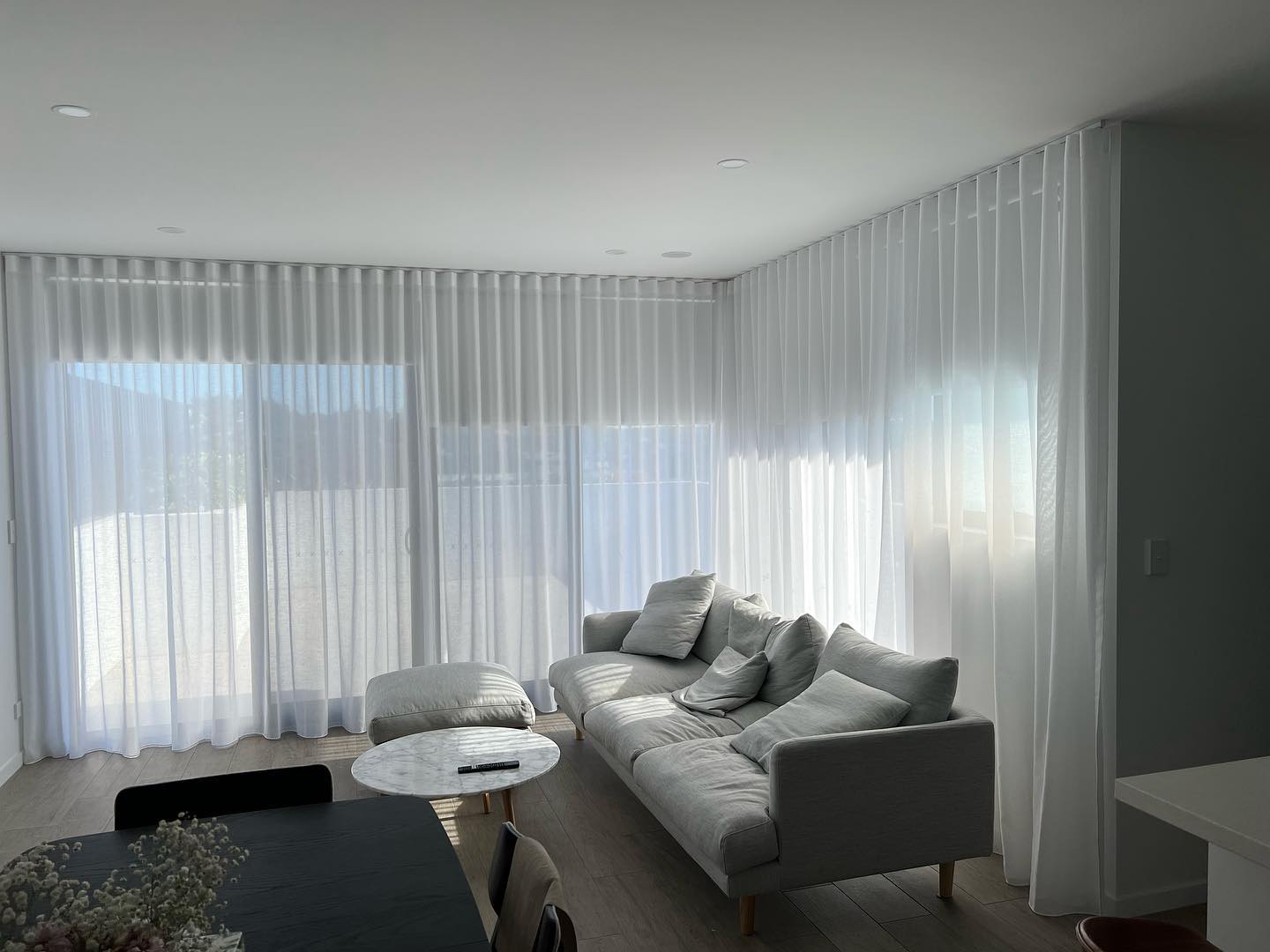 Cozy Living Room With Sheer Fold Curtains — Studio Curtains & Blinds in Mount Gravatt, QLD