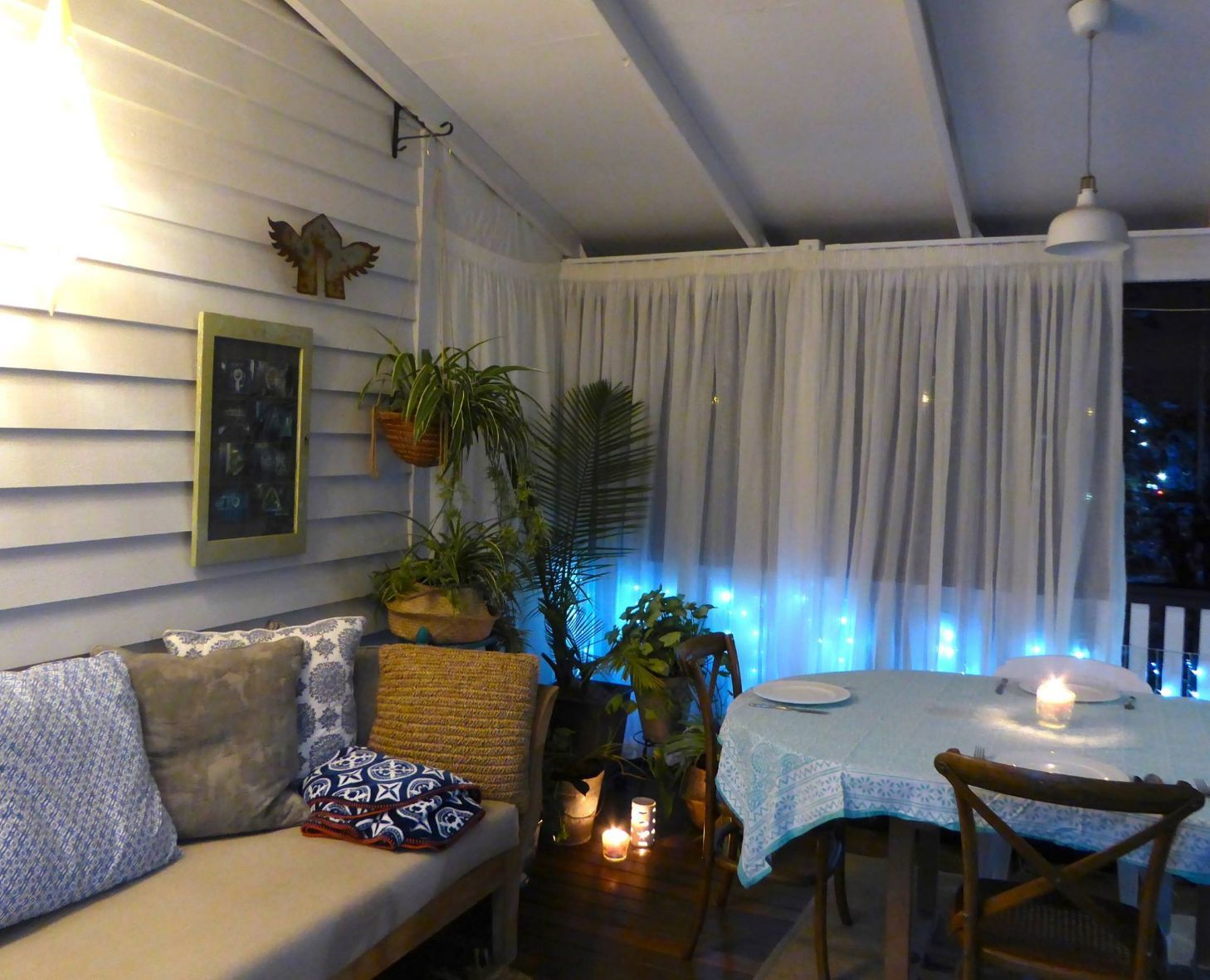 White Pencil Pleat Curtains In A Cozy Room — Studio Curtains & Blinds in Mount Gravatt, QLD