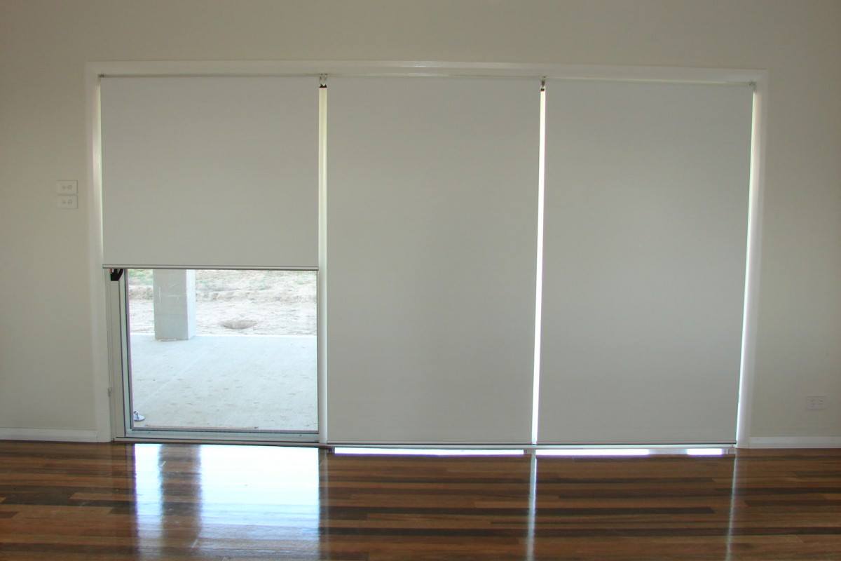White Roller Blinds & Wooden Floor — Studio Curtains & Blinds in Brisbane Southside, QLD